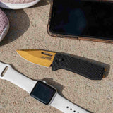 SOG Ultra XR Carbon Gold Folding Knife